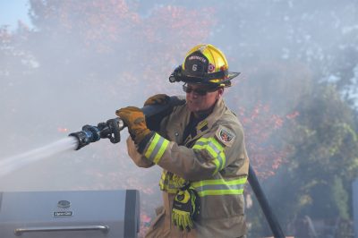 fire fighter using hose