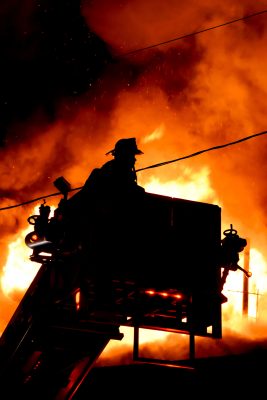 Fire fighter working on a crane during fire