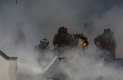 Firefighters dealing with PTSD putting out a fire