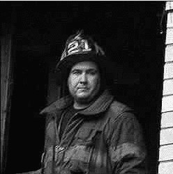 Mike Wells from Prince George County in his fire fighter uniform at the scene of a fire