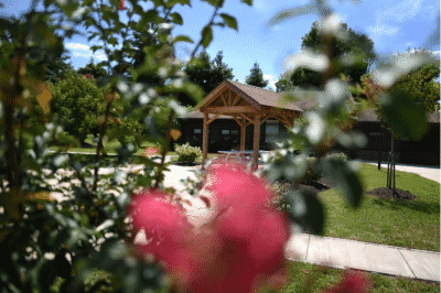 Outdoor view of a gazebo and building at the IAFF Center of Excellence