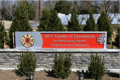 Front facing view of IAFF Center of Excellence outdoor sign